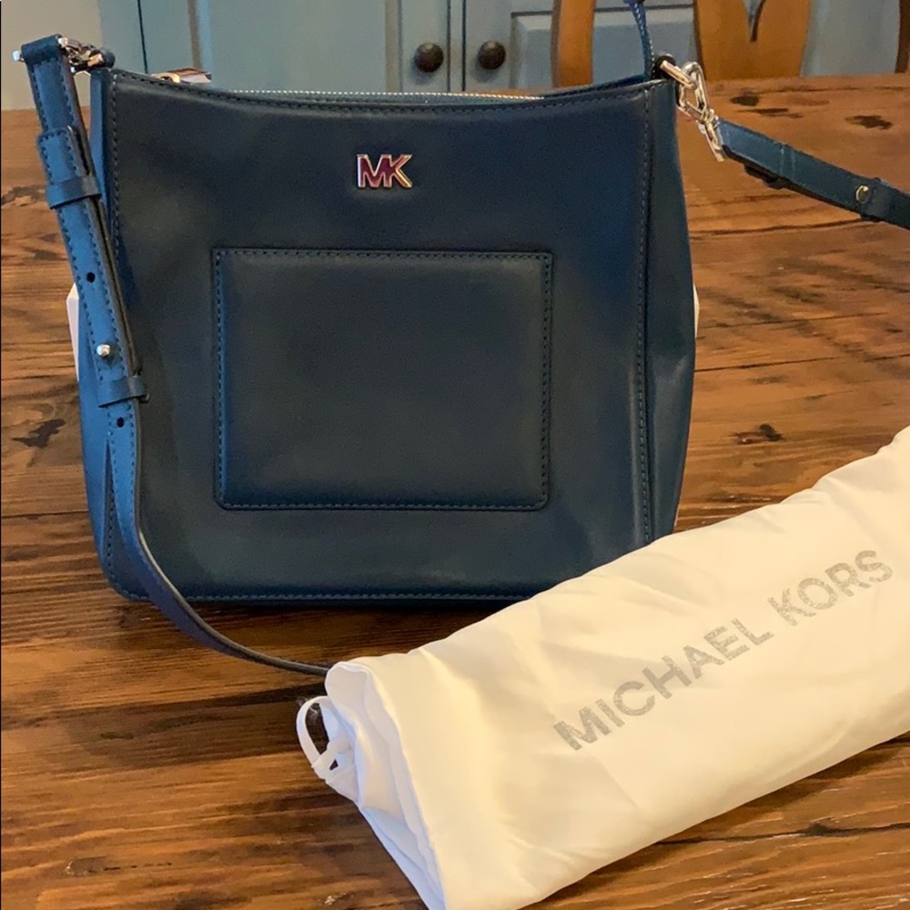 Michael Kors teal crossbody purse with dust cover